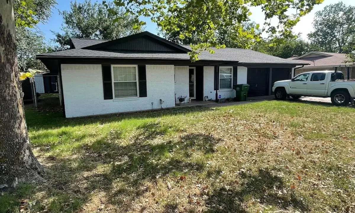 Professional roofing crew working on a residential roof in West Odessa